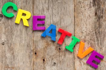 Creative spelled out using colored magnet letters