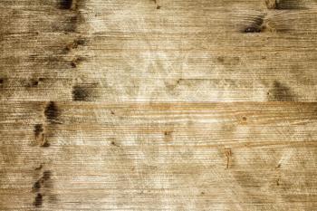 Scratched grungy wood for background or texture