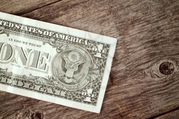 American dollar on the wooden background. United states money, finance concept