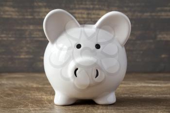 Piggy bank on wooden background.Saving or financial investment concept