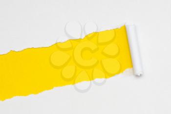 Ripped paper concept. White on yellow. Copy space.