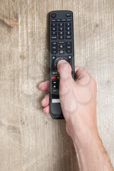 Hand with Tv remote controller 