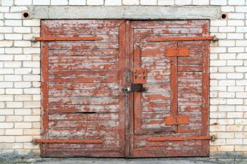 Old wooden door of abandoned garage