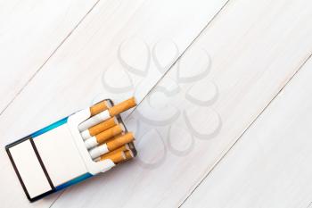 Pack of cigarettes with cigarettes sticking out