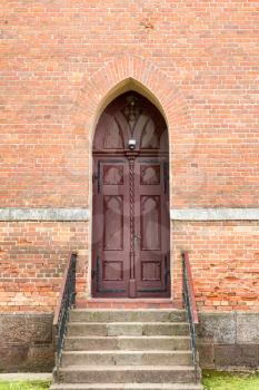 Church front entrance with old wooden doors