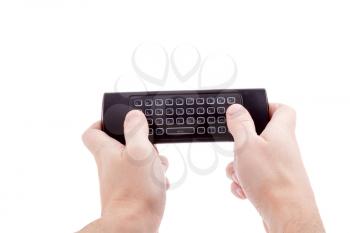 Hands holding smart tv remote control with keyboard. Isolated on white background.