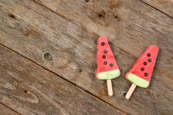 Fruity ice cream on the wooden background. Copy space.