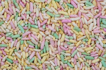 Multi-colored background of painted foam rice