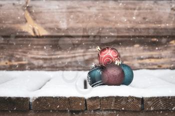 Christmas composition with balls and falling snow 