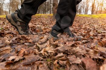 Man walking in comfortable hiking shoes. Active way of life, walk in the forest.