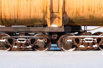 Metal train vehicle in the winter railway. Winter season.