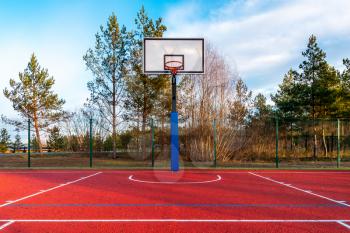 An empty basketball court found in the outdoors