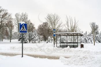 Empty bus stop in the cold snowy weather