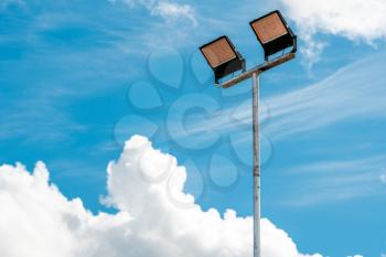 LED street light on blue sky background. Car park or sports ground lamp