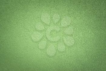 Decorative green texture of plaster on the wall as a background of the embossed surface