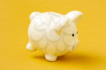 Piggy bank on  yellow background. Money Saving Concept.