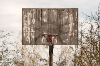 Front view of an old wooden ghetto style basketball hoop