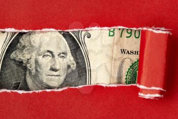 President Washington looks through a hole red ripped paper