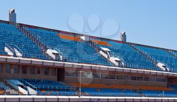Open tribune of stadium in sunny day