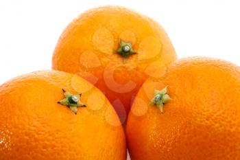 Three ripe  mandarins isolated on white background