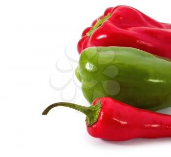 Paprika and chilli pepper on white background