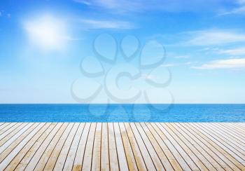 View to sunny sea from wooden pier