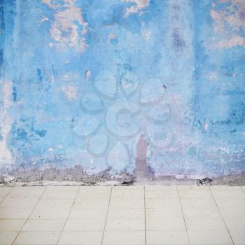Blue weathered wall on the street