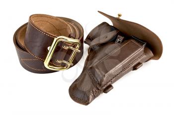 Wide roll of brown belt with a shiny yellow buckle and holster the gun out of the skin is isolated on a white background