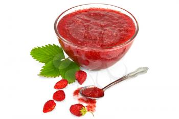 Strawberry jam in a glass cup, a few strawberries with green leaf, a spoonful of jam isolated on a white background