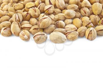 A pile of salted pistachios isolated on a white background