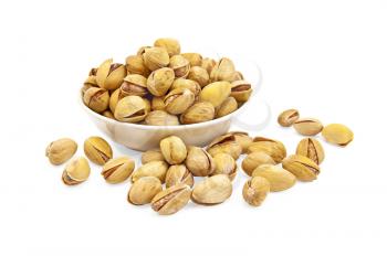 Salted pistachios in a bowl on the table isolated on white background