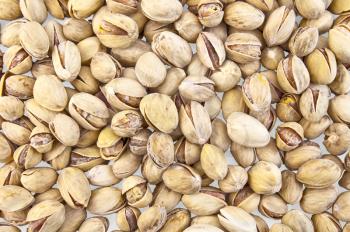 A heap of savory pistachio isolated on white background (texture)