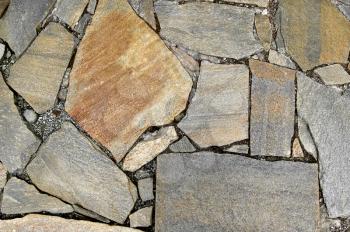 The pavement of granite blocks and black gravel (texture)