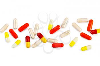 Capsules red, yellow and beige isolated on white background