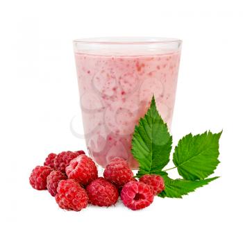 The glass of milkshake, berries and green twig of raspberry isolated on white background