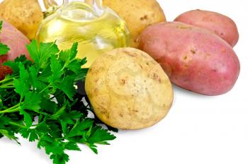 Red and yellow potatoes, parsley, vegetable oil in a bottle isolated on white background
