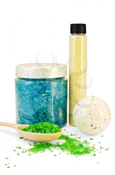 Blue and yellow bath salt in the banks, with a splash of white salt in the form of a ball, the green salt in wooden spoon isolated on white background