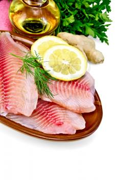 Tilapia fillets with dill, parsley and lemon in a clay pot, a bottle of vegetable oil, ginger, pink napkin isolated on white background