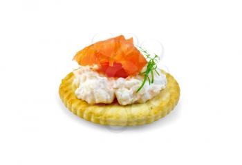 Round cracker with cream, dill and salmon isolated on white background
