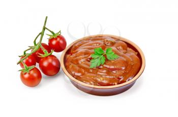 Ketchup in pottery with tomatoes and parsley isolated on white background