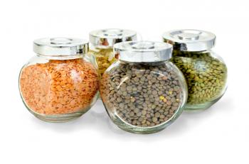 Lentils green, red, brown, pea flakes in a glass jar isolated on white background