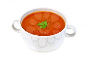 Tomato soup in a white bowl with parsley isolated on white background
