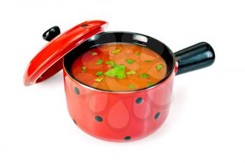 Tomato soup in a red ware with parsley, cover isolated on white background