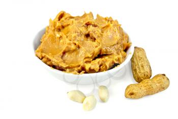Peanut butter in the bowl, peanuts in the shell and cleaned isolated on white background