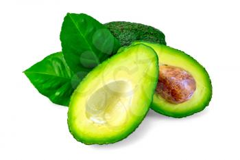 One whole and one cut in half avocado, bone, two green leaves isolated on white background