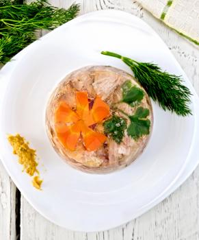 Jellied pork and beef with carrots and parsley on a plate with mustard and dill, a towel on the background of the wooden planks on top