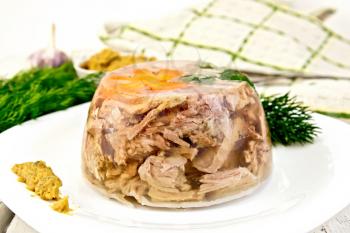 Jellied pork meat and beef, decorated with a flower from carrots and parsley on a plate with mustard and dill, kitchen towel on a background of wooden boards