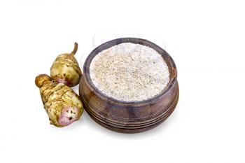 Jerusalem artichoke flour in a bowl with two tubers isolated on white background
