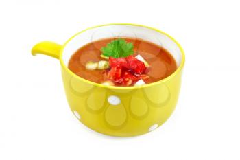 Gazpacho tomato soup in yellow bowl with parsley isolated on white background