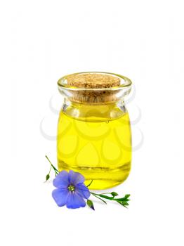 Linseed oil in a glass jar with blue flax flower isolated on white background